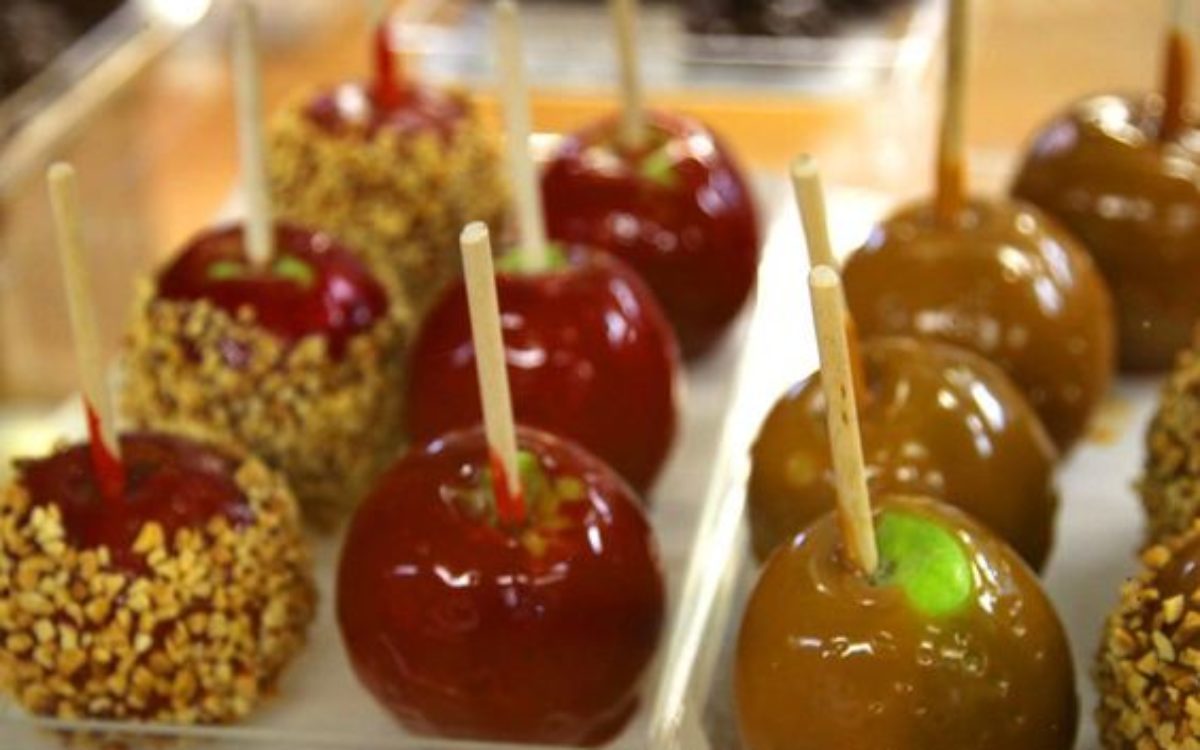 rows of candy apples and caramel apples in candy store in Helen GA