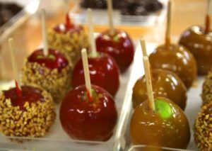 rows of candy apples and caramel apples in candy store in Helen GA