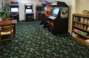 Game room with arcade games at Loreley Resort