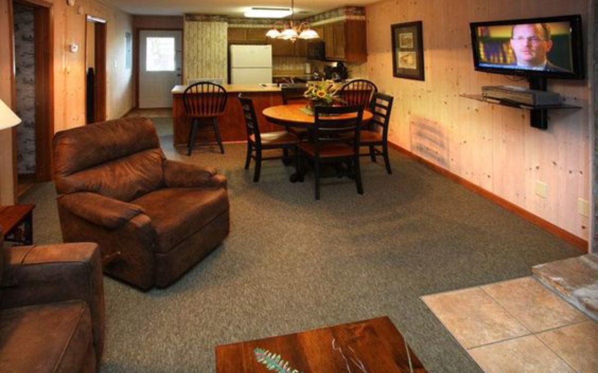 Living area with kitchen in 2 bedroom condo at Loreley Resort