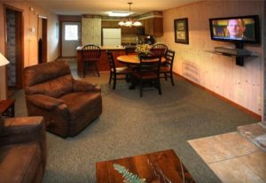 Living area with kitchen in 2 bedroom condo at Loreley Resort