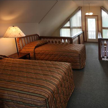 Loft bedroom with two beds at Loreley Resort
