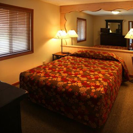 Bedroom with queen bed in condo at Loreley Resort